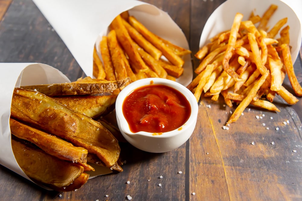 Gourmet french fries with various seasoning options at OnlySides